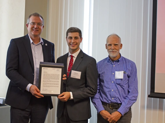 Josh Pace, outstanding senior in biomedical engineering, with nominator Art Gmitro and Craig M. Berge Dean David Hahn.