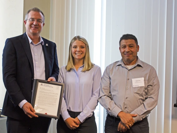 Madeline Melichar, outstanding senior in biosystems engineering, with nominator Kamel Didan and Craig M. Berge Dean David Hahn.