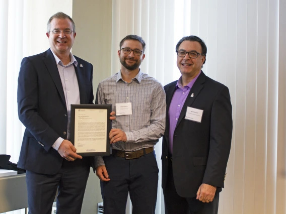 Daniel Higgins, outstanding senior in mining engineering, with nominator Moe Momayez and Craig M. Berge Dean David Hahn.