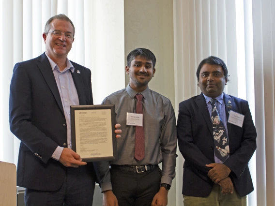 Ravi Teja Nallapu, outstanding graduate student in aerospace engineering, with nominator Jekan Thanga and Craig M. Berge Dean David Hahn.