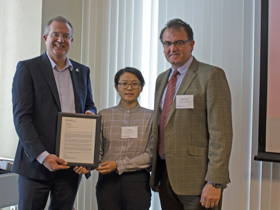 Yin Zhang, outstanding graduate student in biosystems engineering, with nominator Murat Kacira and Craig M. Berge Dean David Hahn.