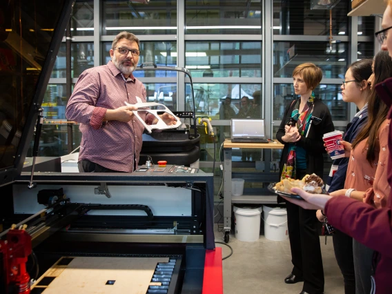 Biomedical associate professor Urs Utzinger shows a group some of the lab's equipment.