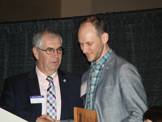 Young Professional Achievement Award recipient Ryan Kanto, right, with Dean Jeff Goldberg