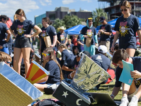 Many students work outdoors with homemade solar ovens
