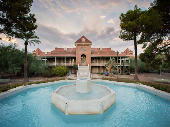 A shot of the University of Arizona's Old Main building, with a fountain in the foreground.