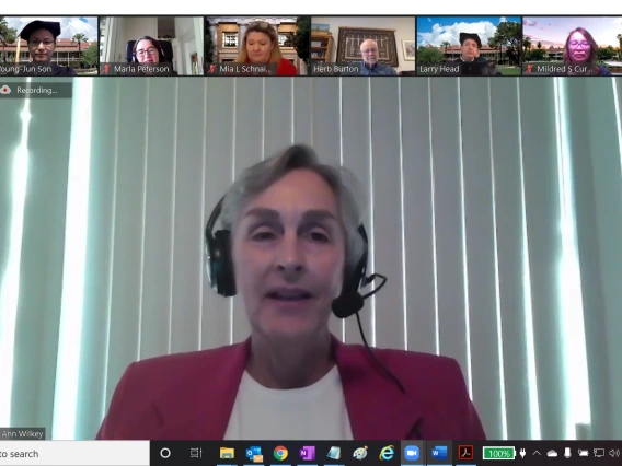 Screenshot of a Zoom meeting, with Ann Wilkey full screen and a few other people lined up across the top.