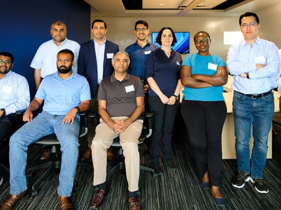 a group of faculty members posing for a photo