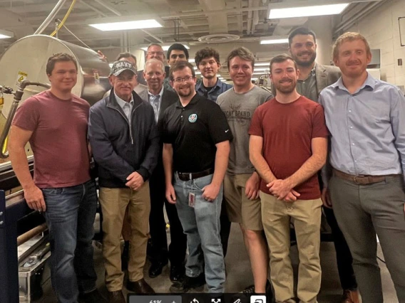 a large group of people in a wind tunnel testing facility