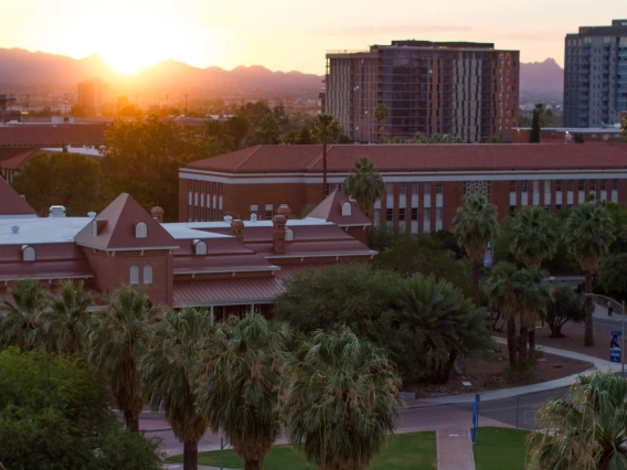 The University of Arizona mall and Old Main building, seen from above at sunset.