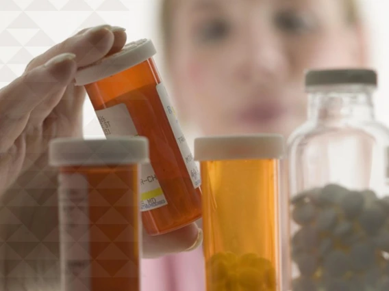 a pharmacist examines medications