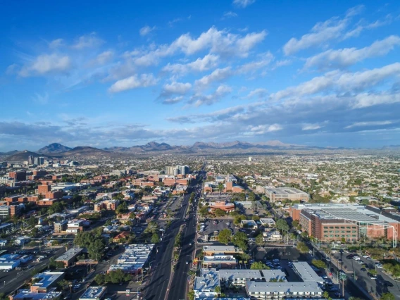 An aerial view of Tucson, looking from the east, including Speedway Boulevard and parts of the University of Arizona campus.