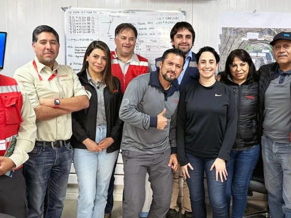 A group stands in a mining office