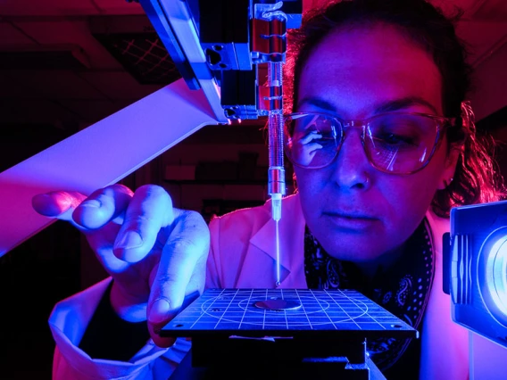 Vicky Karanikola works with water purification equipment in a lab