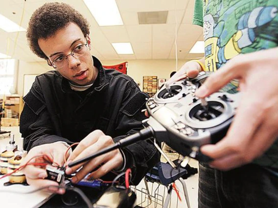 student with robot