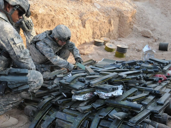 soldiers with weapons cache