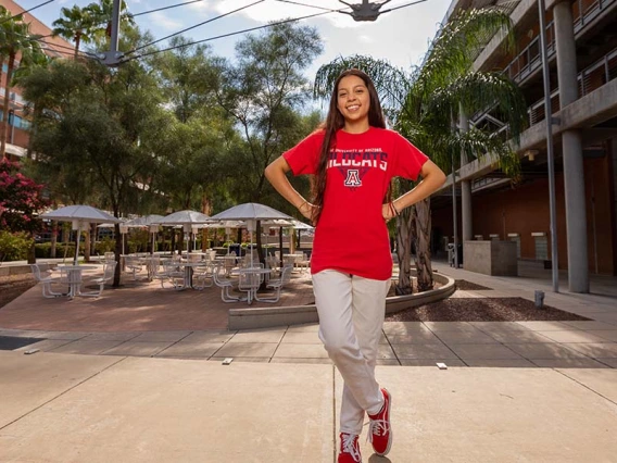 a student standing outside a building