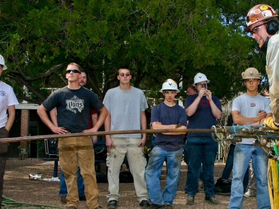 mining engineering students drilling rocks