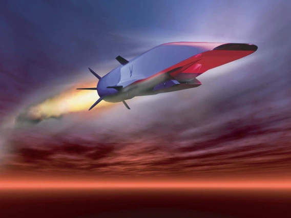 Artist's rendering of a hypersonic vehicle -- a large silver structure leaving a trail of flames behind it as it flies through the clouds.