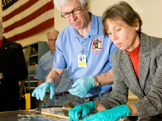 scientists examining sample material