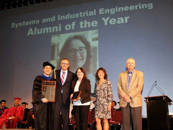 Young-Jun Son, Ted Landis, Marla Peterson, Ted Landis, Cindy Klingberg and Herb Burton on stage at SIE convocation ceremony