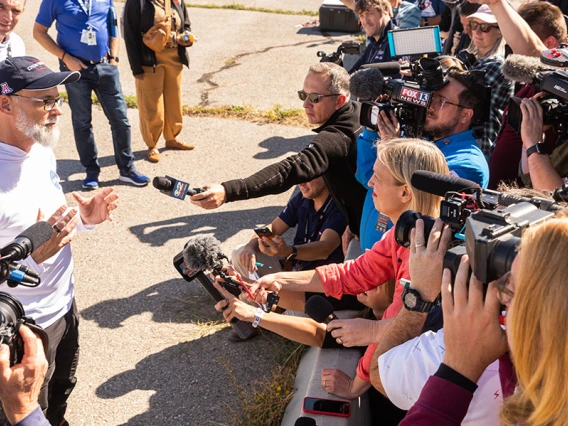 a news conference at the sample landing site