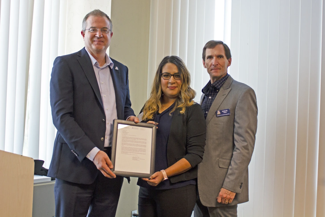 Yesenia Machuca, outstanding senior in systems engineering, with nominator Sam Peffers and Craig M. Berge Dean David Hahn.