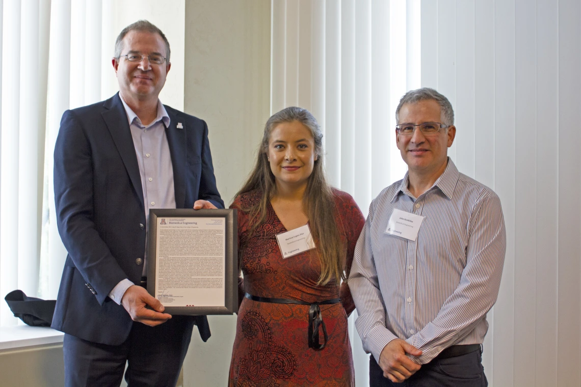 Marissa Lopez-Pier, outstanding graduate student in biomedical engineering, with nominator John Konhilas and Craig M. Berge Dean David Hahn.