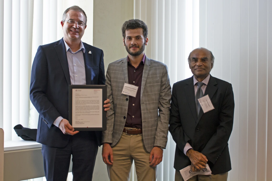 Sayyed Mohsen Vazirizade, outstanding graduate student in civil engineering and engineering management, with nominator Achintya Haldar and Craig M. Berge Dean David Hahn.