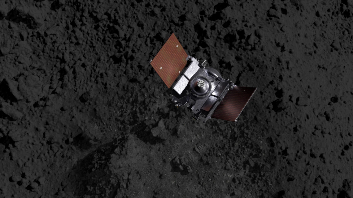 A spacecraft above an asteroid's terrain (artist's impression).