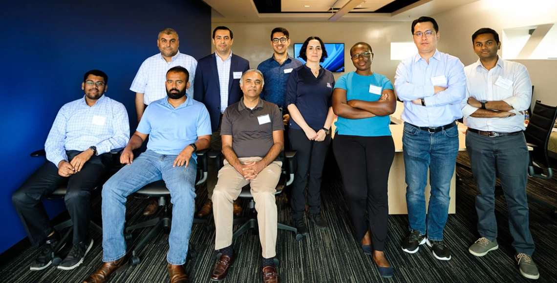 a group of faculty members posing for a photo