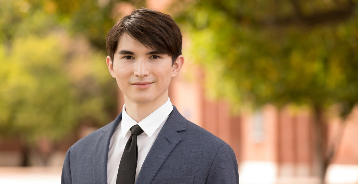 Daniel Wieland wearing a suit and tie.