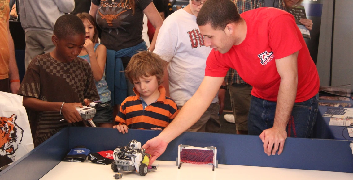 kids playing with robots