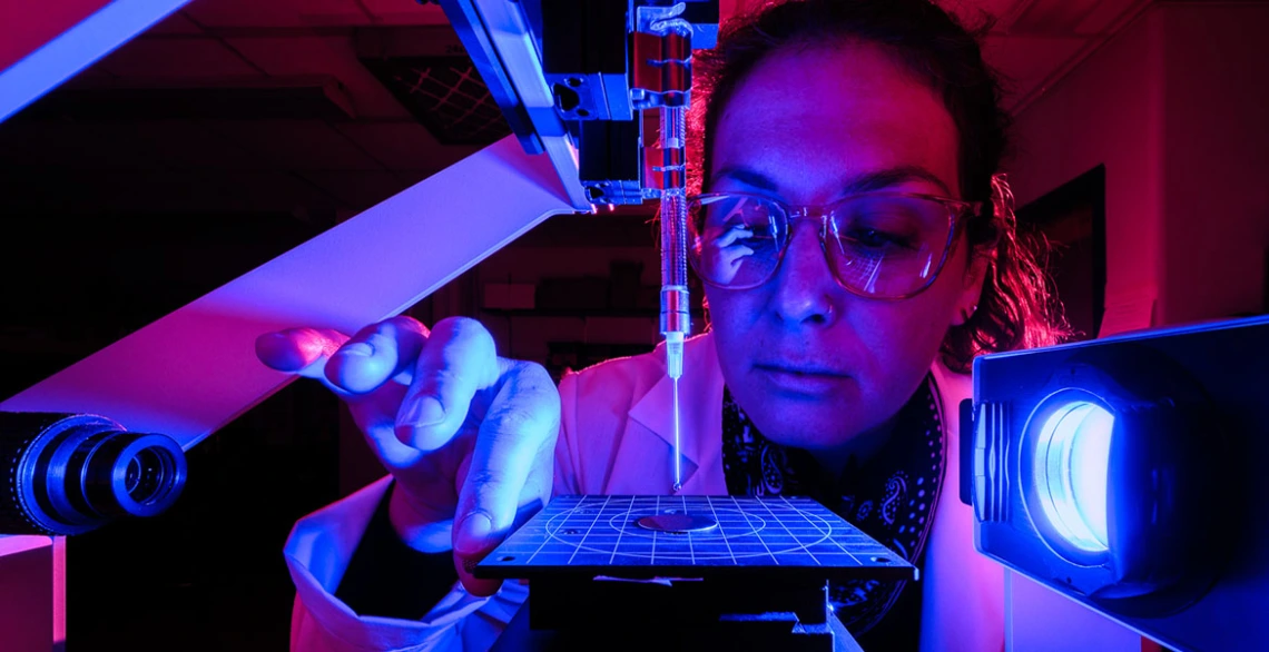 Vicky Karanikola works with water purification equipment in a lab