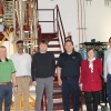 Researchers pose in an Applied Research Building lab.