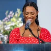 Aaliyah Thompson-Mazzeo speaks at a podium.