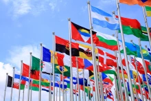 Flags from several countries fly on poles