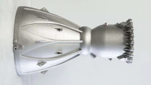 a silver 3D-printed part shaped like two funnels connected on the narrow end