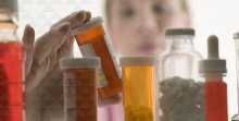 a pharmacist examines medications