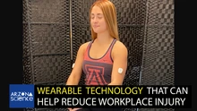 A young woman wearing a University of Arizona tanktop and wearing a white sensor on each bicep. Text on bottom third reads, "Wearable technology that can help reduce workplace injury."