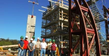 engineers standing next to giant earthquake test rig