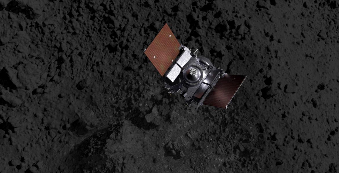 A spacecraft above an asteroid's terrain (artist's impression).