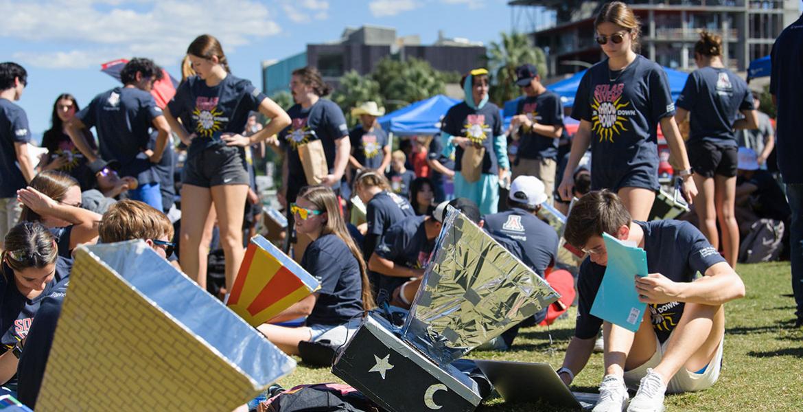 Many students work outdoors with homemade solar ovens