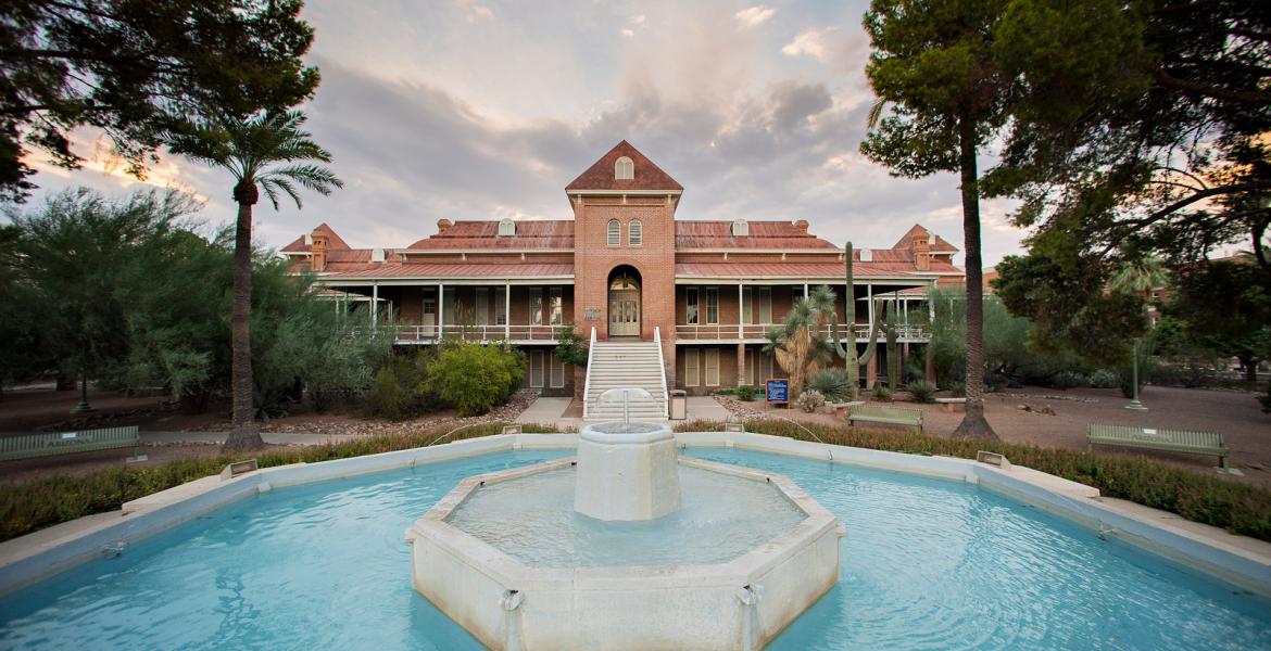 A shot of the University of Arizona's Old Main building, with a fountain in the foreground.