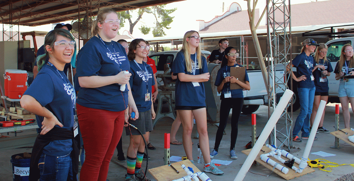 A group of high school girls wearing matching blue 