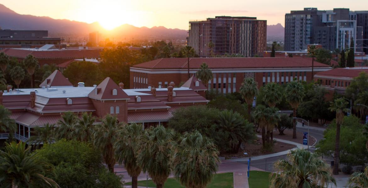 The University of Arizona mall and Old Main building, seen from above at sunset.