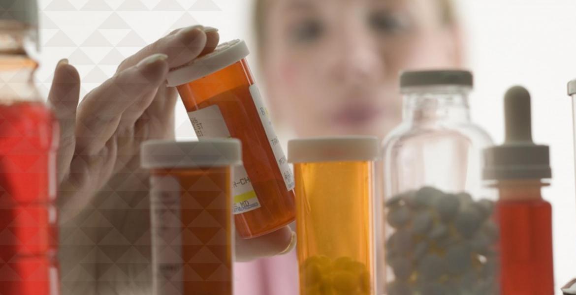 a pharmacist examines medications