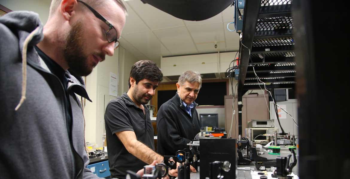 Joshua Olson, Veysi Demir and Nasser Peyghambarian in the lab