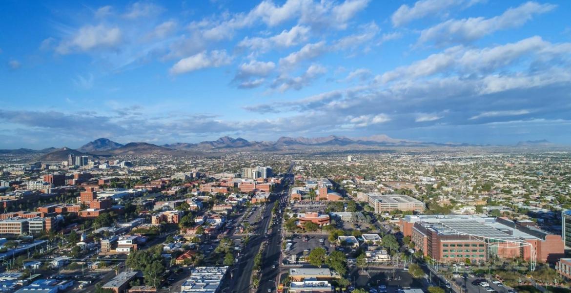 An aerial view of Tucson, looking from the east, including Speedway Boulevard and parts of the University of Arizona campus.