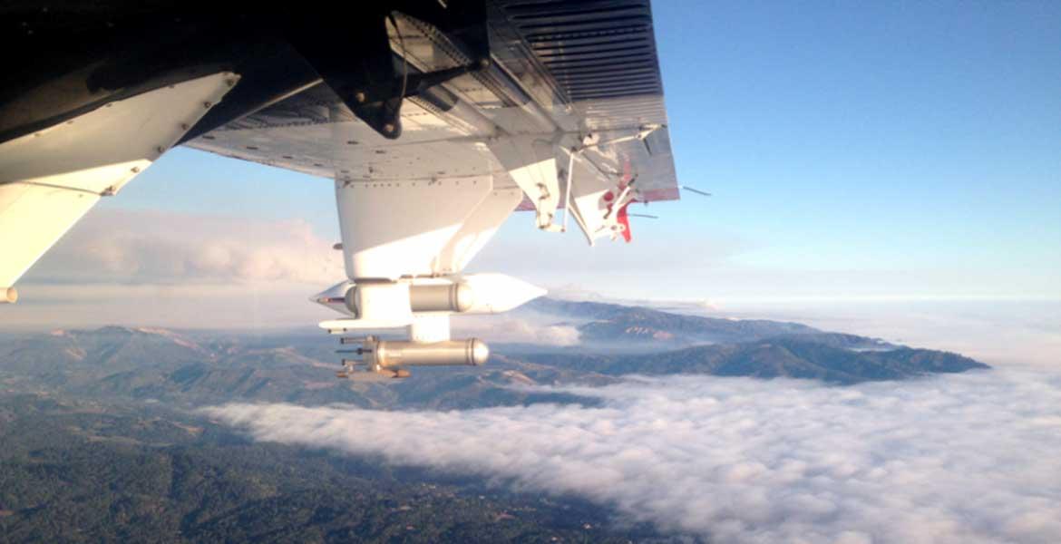 Photo taken from inside an airplane flying above the cloud layer.