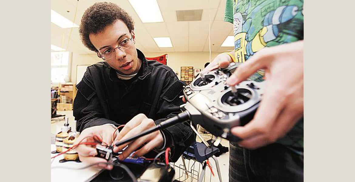 student with robot